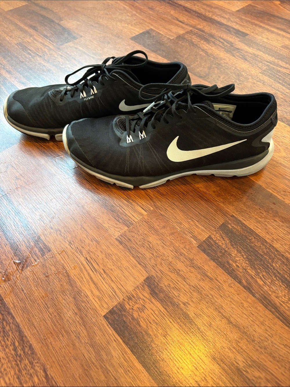 Nike women’s Black Athletic Sneakers with White Swoosh